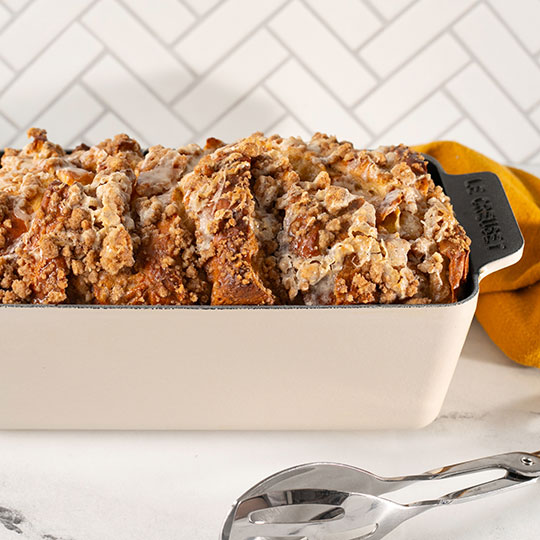streusel topped bread pudding loaf in a loaf pan