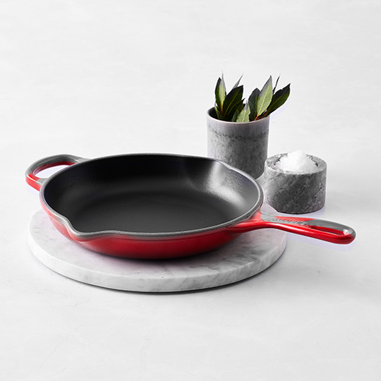 blue cast iron skillet on counter