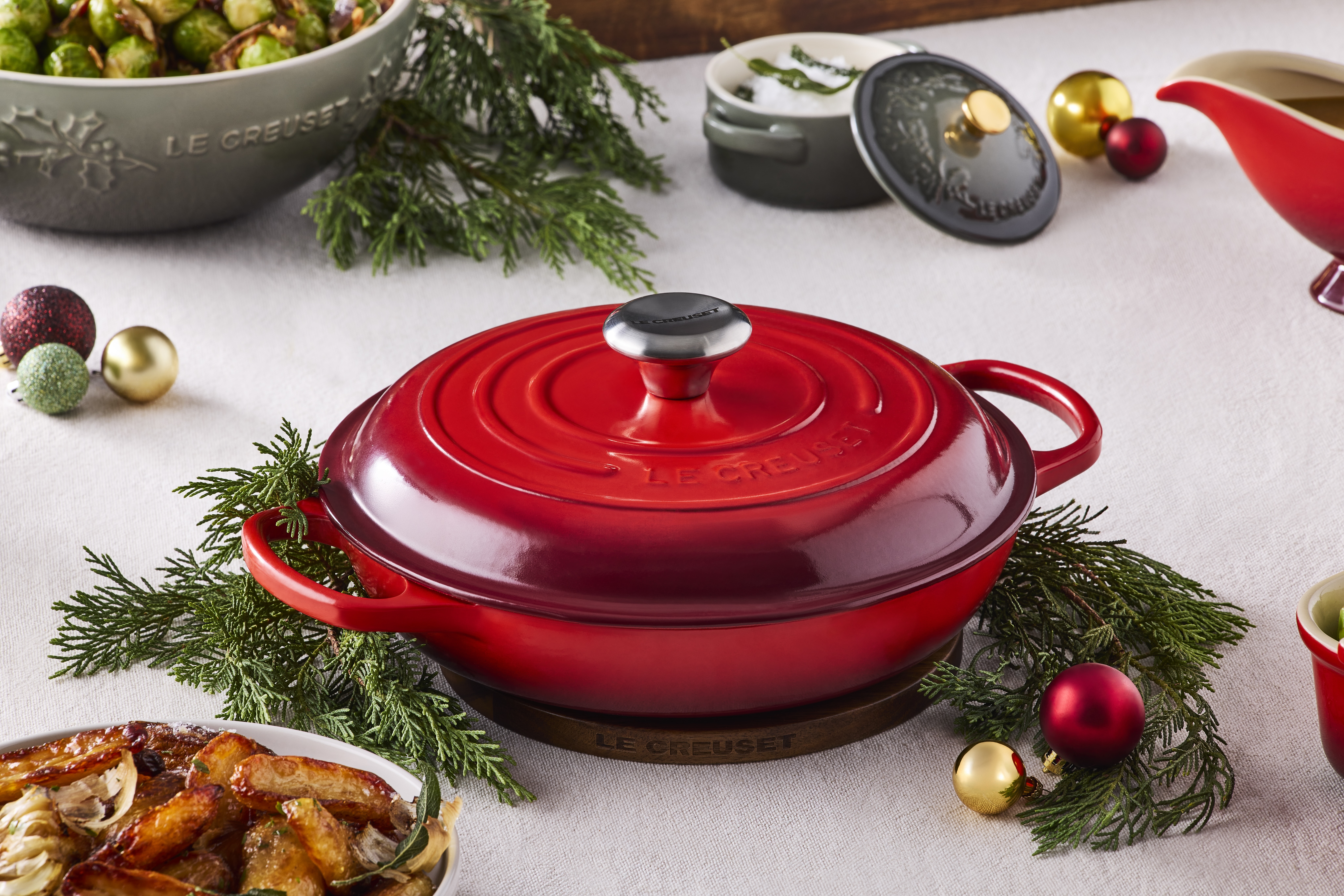 Le Creuset Cast Iron Signature Shallow Casserole on festive table