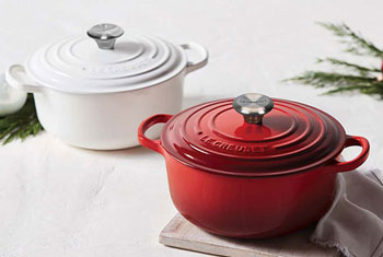 two dutch ovens in red and white