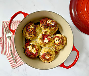 cheese stuffed chicken in a dutch oven