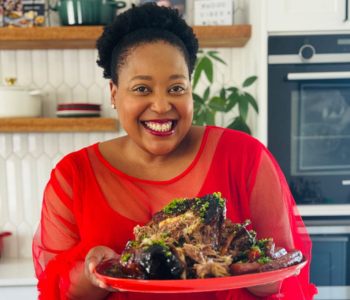 Zola serving a dish on the Le Creuset Oval Platter