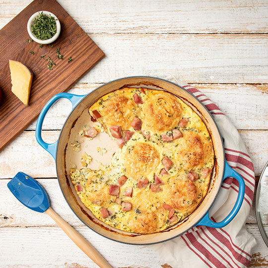 caribbean blue braiser with biscuits and ham in a creamy sauce