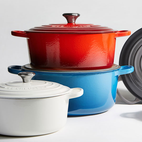 assortment of colorful dutch ovens