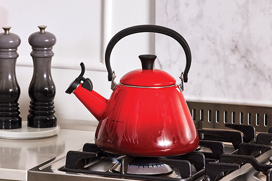 small shelf riser creates additional space for cookware