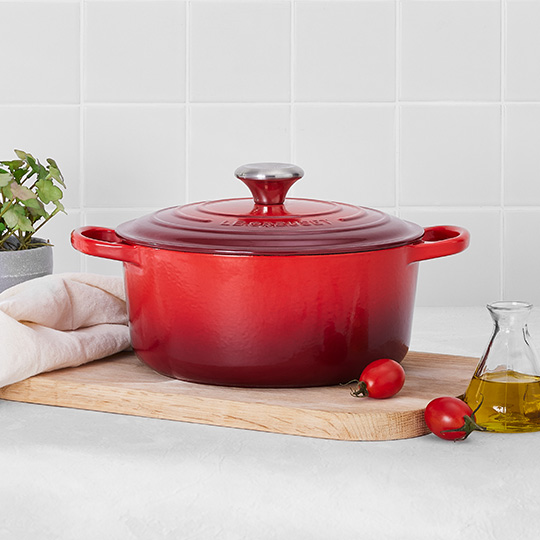 navy blue dutch oven on a tabletop