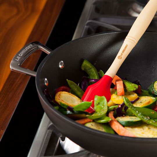 stir-frying veggies in a nonstick fry pan
