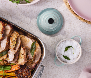 Blue Mini Cocotte on a table with lamb roast next to it