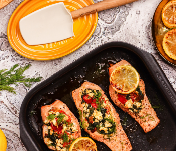 Baby Spinach and Feta Stuffed Salmon with spatula