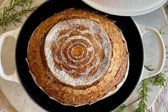 bread with the flower stencil applied