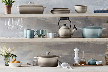sea salt light green, white and nutmeg light brown cookware on shelves