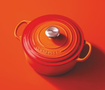 Le Creuset cast iron casserole in flame