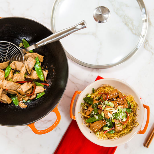 chicken stir-fry in a wok shaped bowl