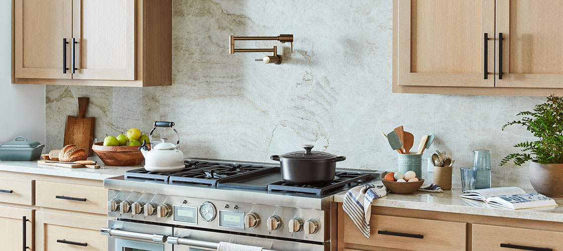 modern kitchen with wooden shaker cabinets and a dramatic marble backsplash