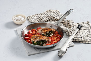 pork chops in a stainless steel fry pan