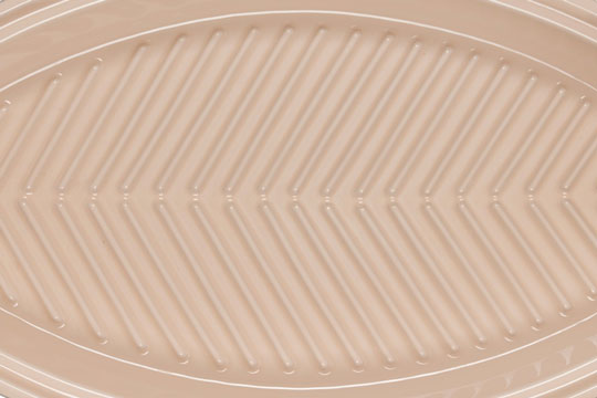 raised ridges in the base of the fish baker