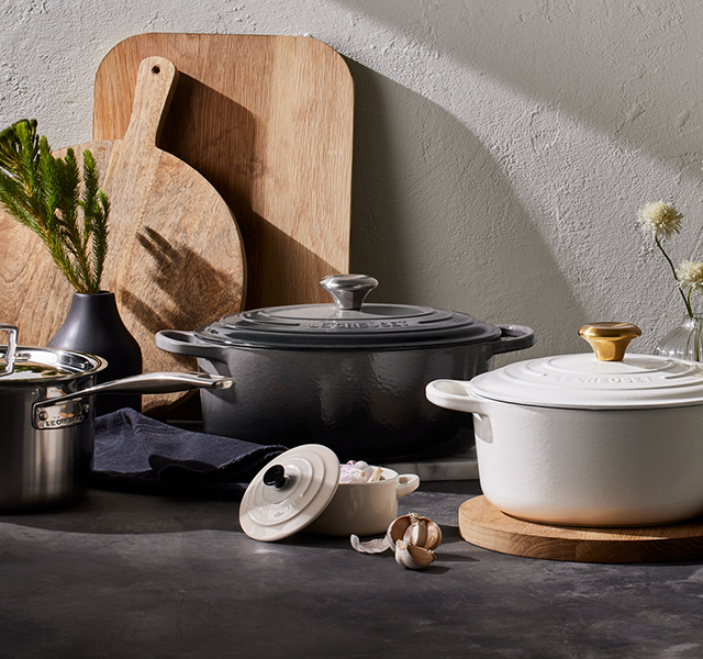 oyster gray on shelves featuring an array of vibrant Le Creuset colours