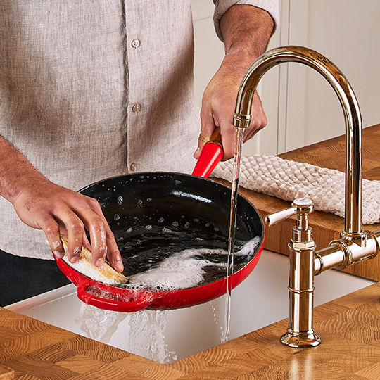 soap suds on a piece of cookware