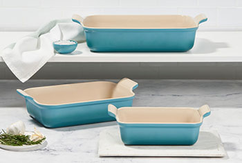 turquoise stoneware bakers on shelves