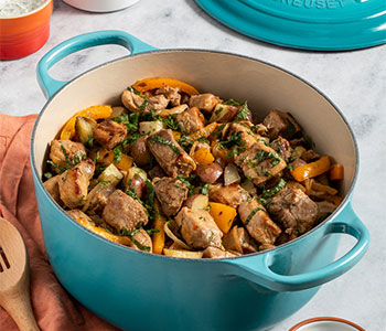 seasoned pork and veggies in a dutch oven