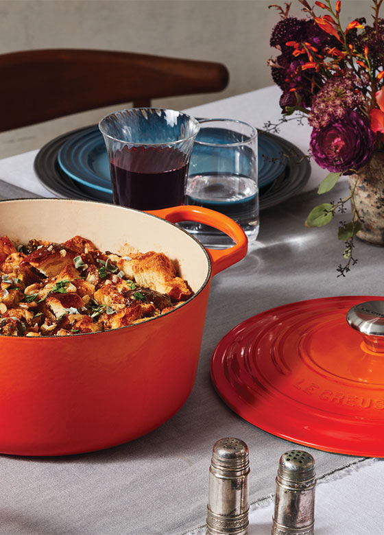 flame orange dutch oven on table