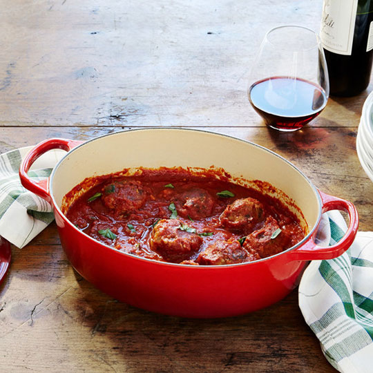 meatballs in red sauce inside a cast iron casserole
