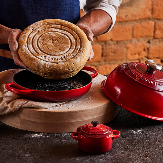 wiping the inside of a pan with a paper towel