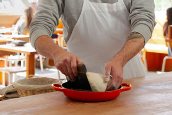 a chef works with bread dough