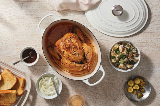 whole chicken in an oval Dutch Oven