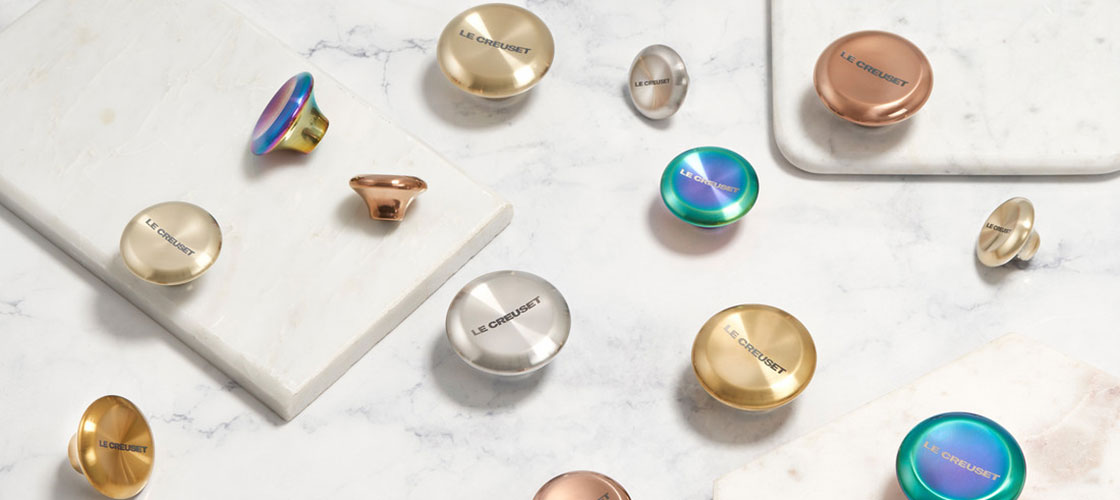 assorted colors and styles of knobs on a counter