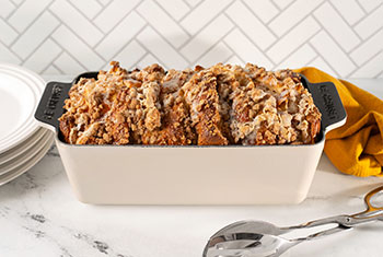 sweet bread in a beige loaf pan