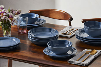 place settings on a table in light blue