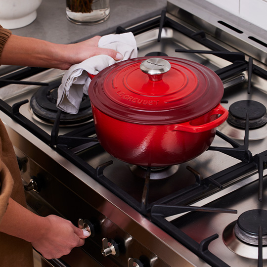 Signature Round Casserole in Cerise on Stove Top
