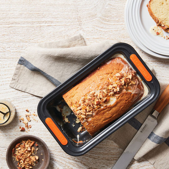 glazed loaf cake in a loaf pan