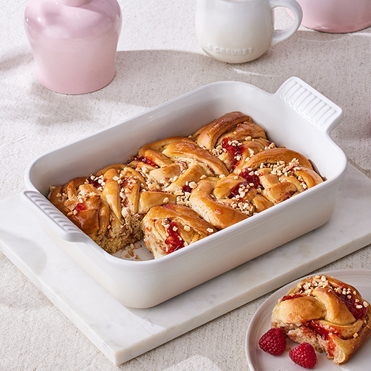 cherry clafoutis baked in a square stoneware covered baker