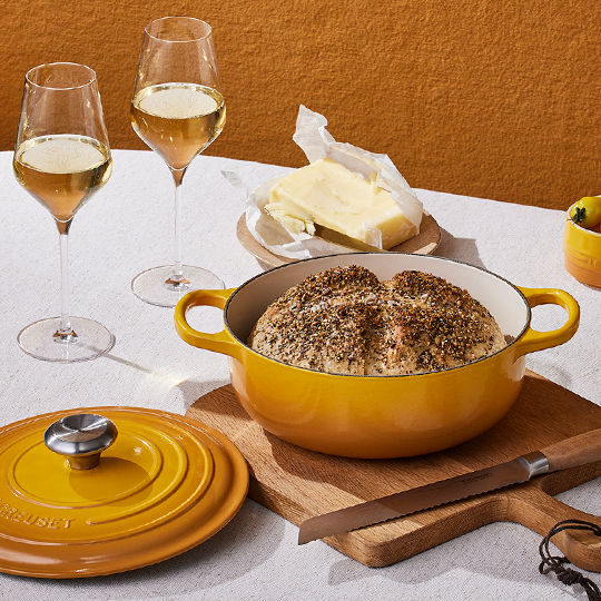 red rice and shrimp in a shallow red dutch oven