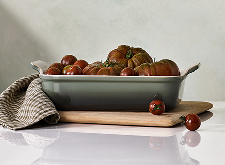 harvesting fresh thyme from a garden
