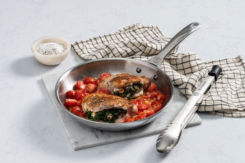 Goat Cheese Stuffed Pork Chops with Tomato Shallot Pan Sauce